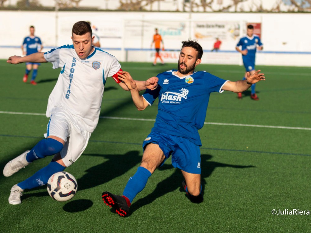 Sant Lluis tackles CF Sporting de Mahon player